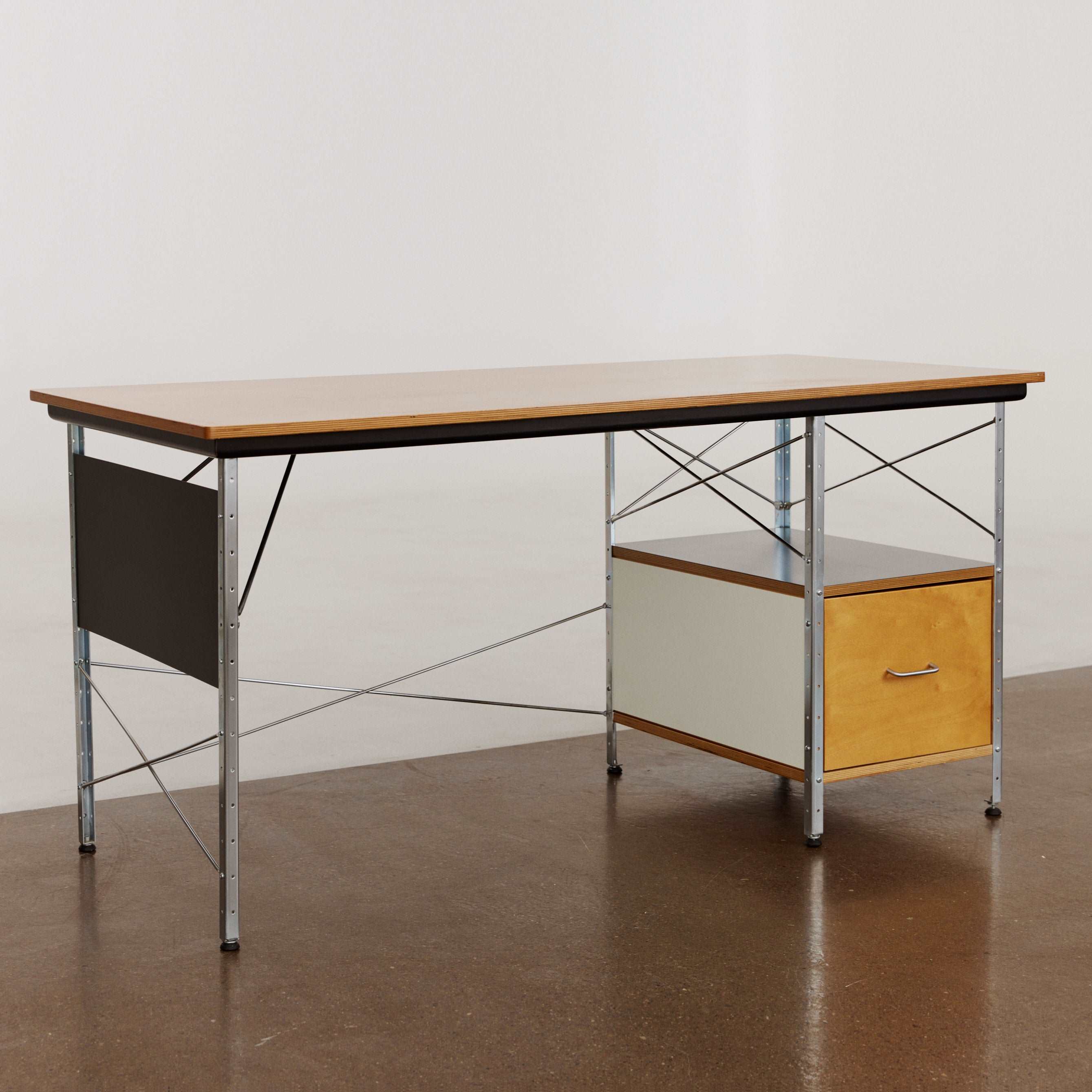 Eames desk unit with right-hand file drawer. Zinc frame with natural-colored panels. Designed by Charles and Ray Eames for Herman Miller.