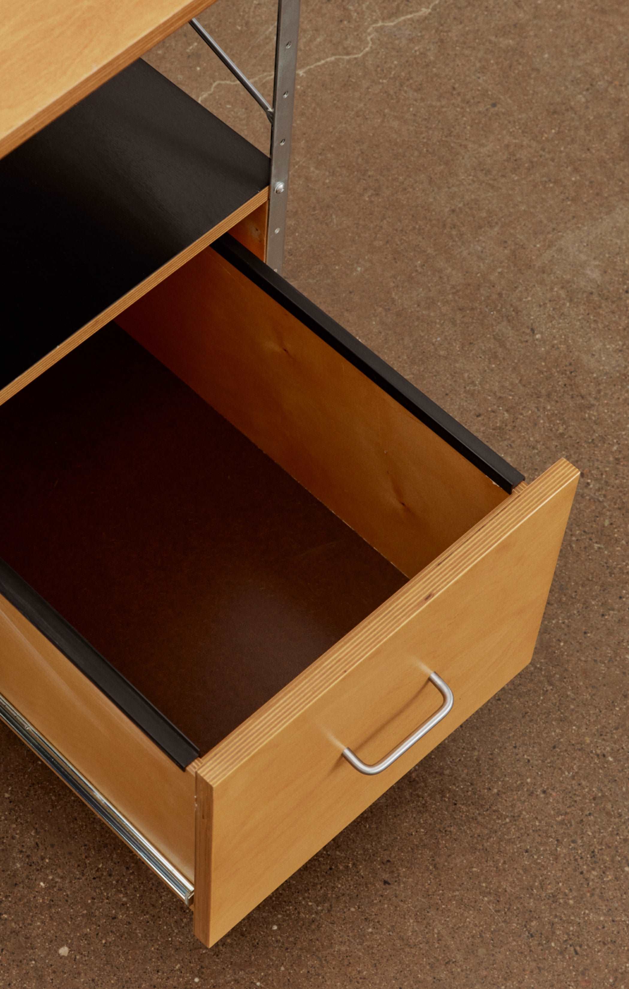 Eames desk unit with right-hand file drawer. Zinc frame with natural-colored panels. Designed by Charles and Ray Eames for Herman Miller.