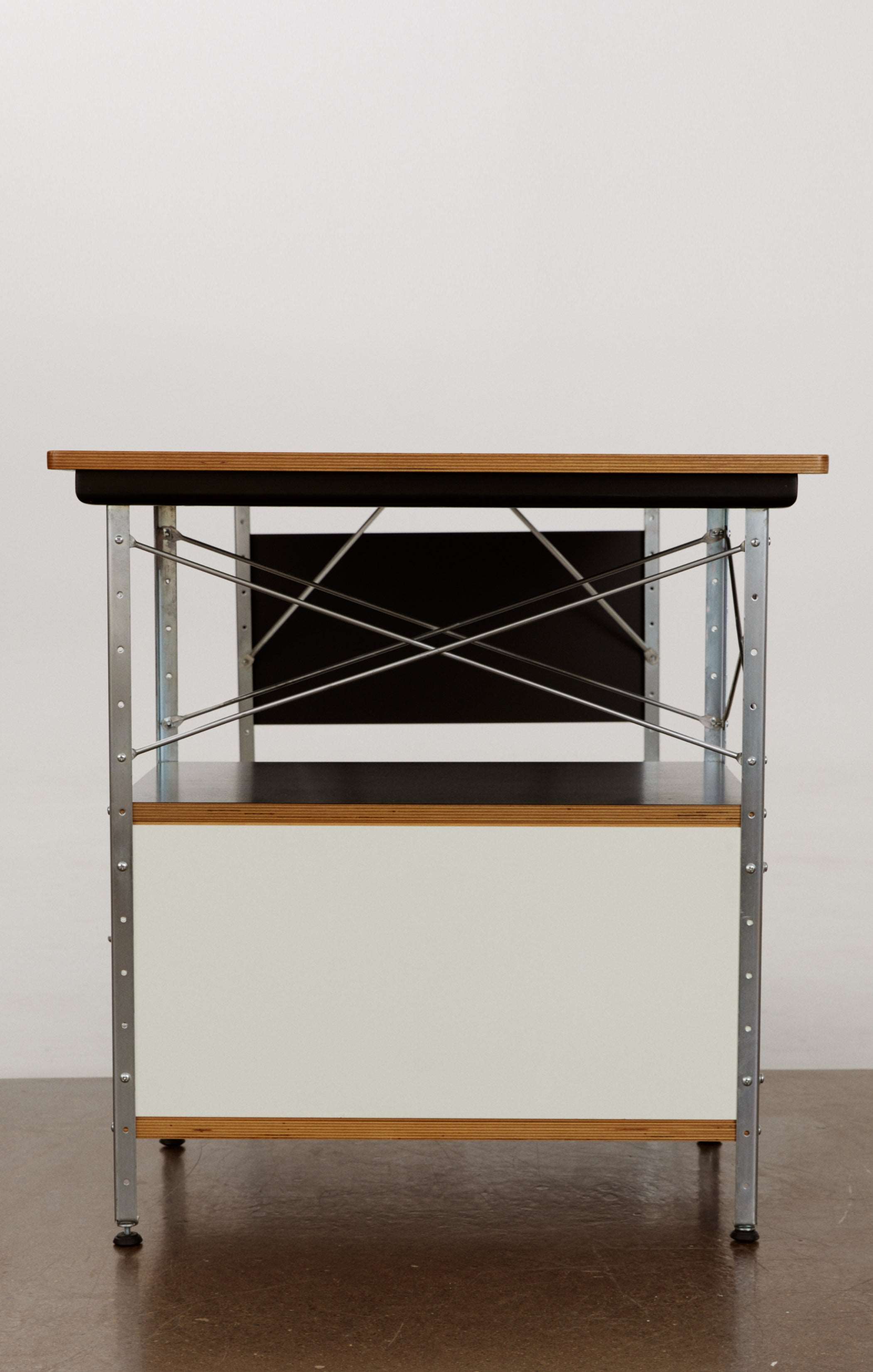 Eames desk unit with right-hand file drawer. Zinc frame with natural-colored panels. Designed by Charles and Ray Eames for Herman Miller.