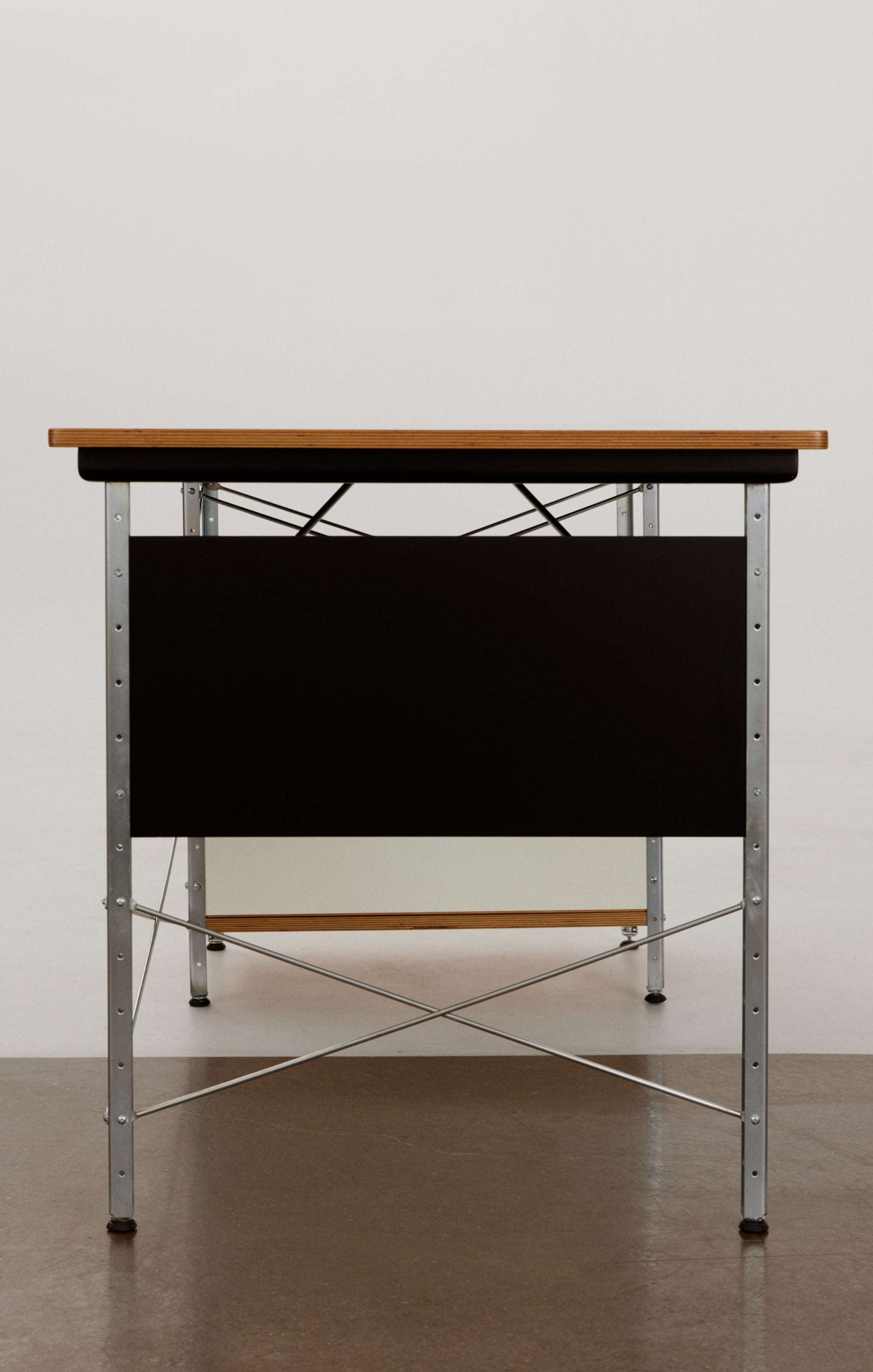 Eames desk unit with right-hand file drawer. Zinc frame with natural-colored panels. Designed by Charles and Ray Eames for Herman Miller.