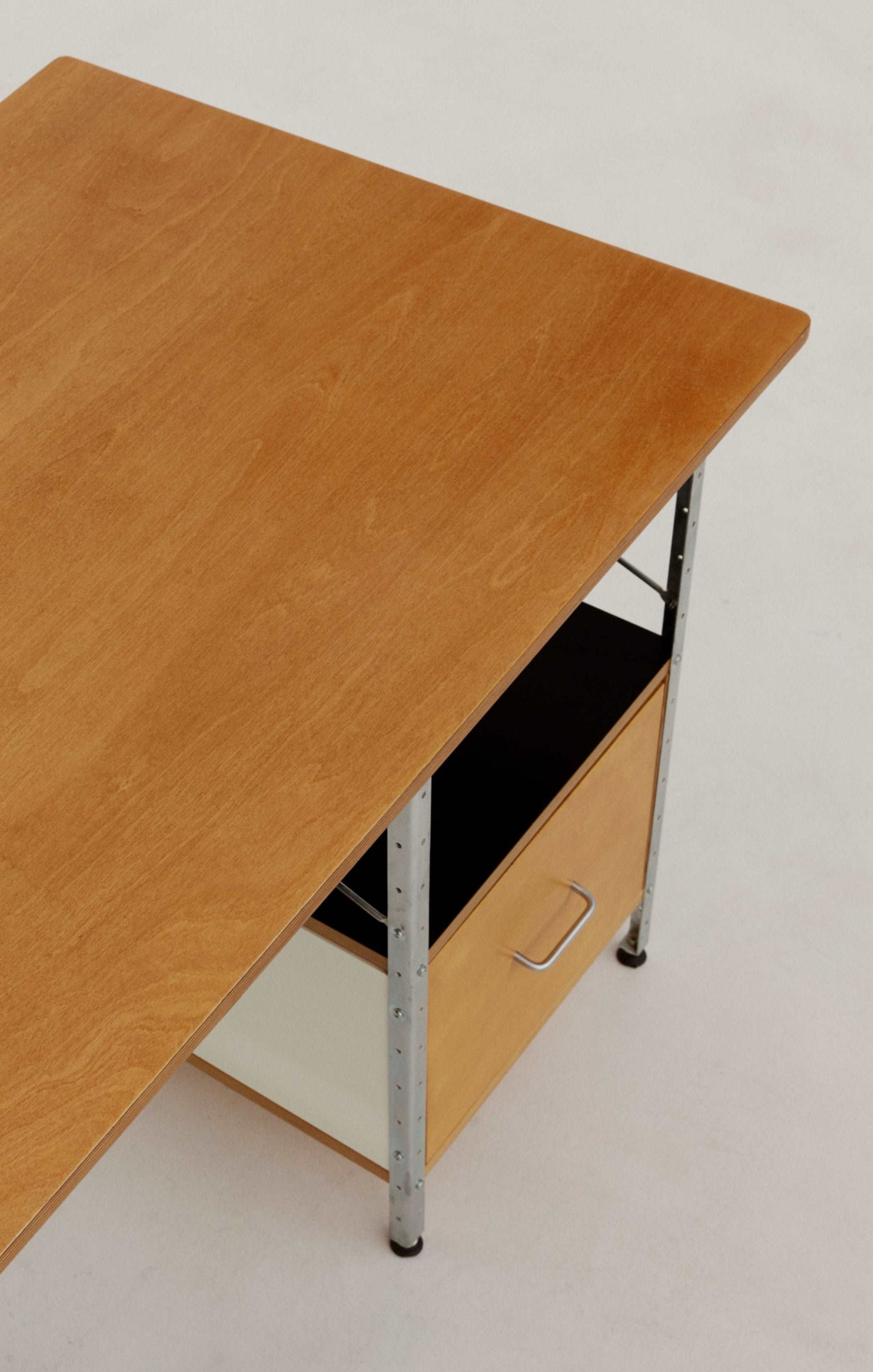 Eames desk unit with right-hand file drawer. Zinc frame with natural-colored panels. Designed by Charles and Ray Eames for Herman Miller.